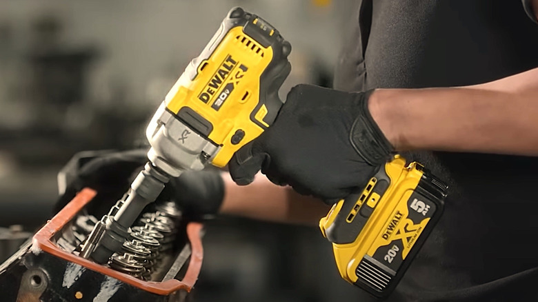 Person holding DeWalt 20XR powered tool