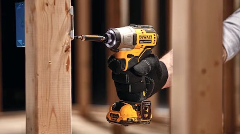 Person using DeWalt Xtreme impact driver