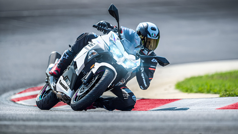 Person riding a 2023 Ninja 400 on track