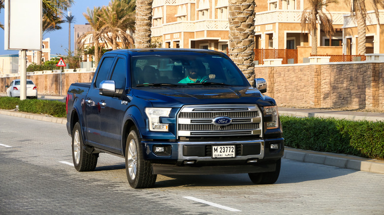 Man driving pickup truck