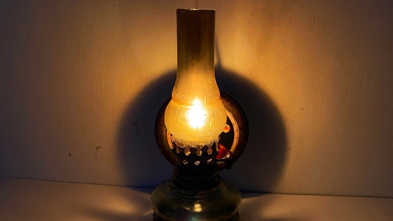 A kerosene lamp lit