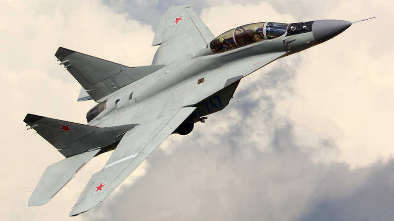 Russian MiG-35 flying over clouds