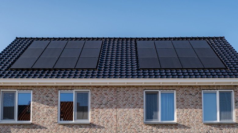 Black monocrystalline solar panels on a roof