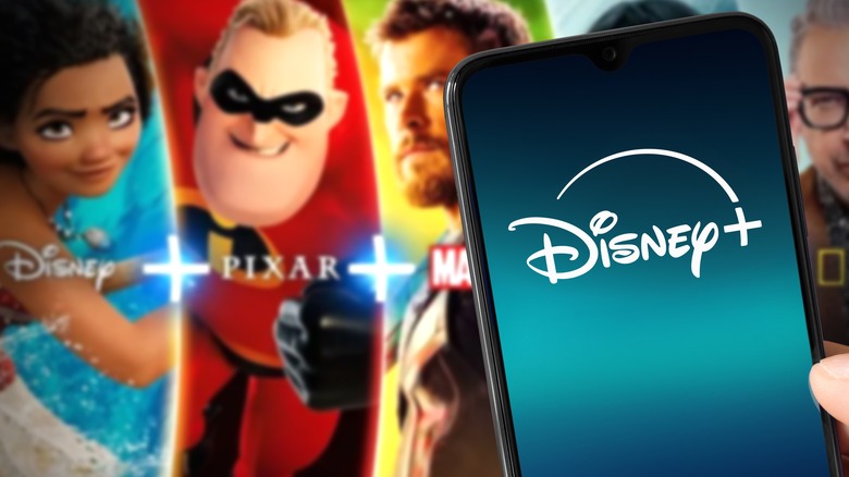 Disney+ logo on phone in front of banner