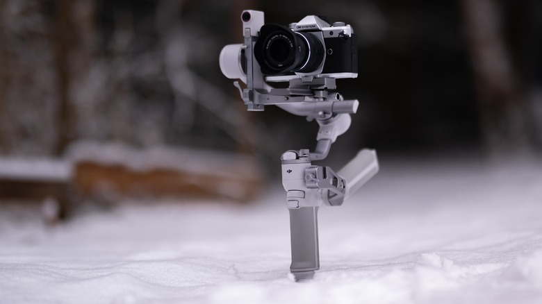 The DJI RS 4 Mini with the OM System OM-3 mounted on top.