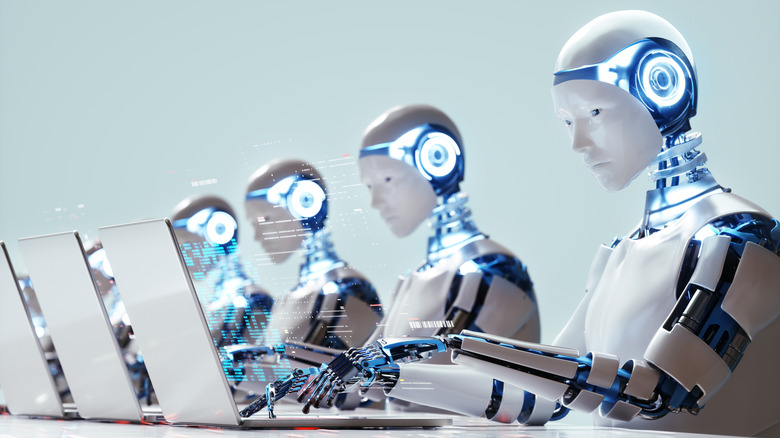 Digital generated image of multiple robots working on laptops siting in a row