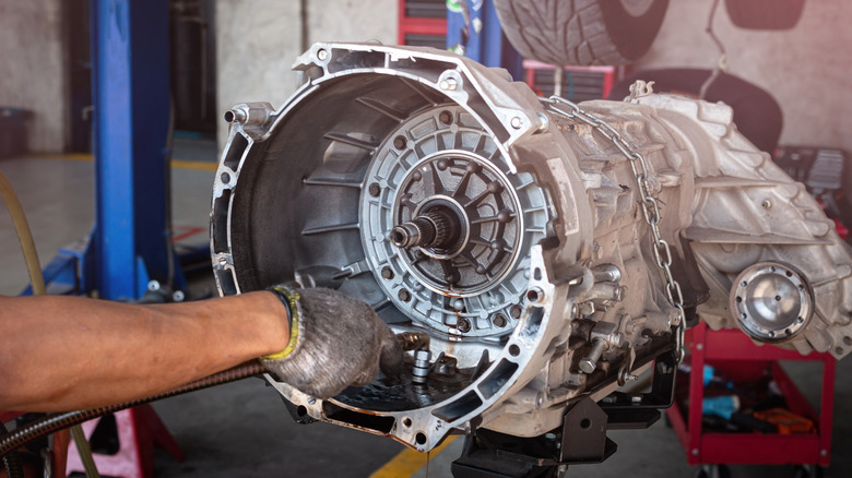 Mechanic working on an automatic transmission