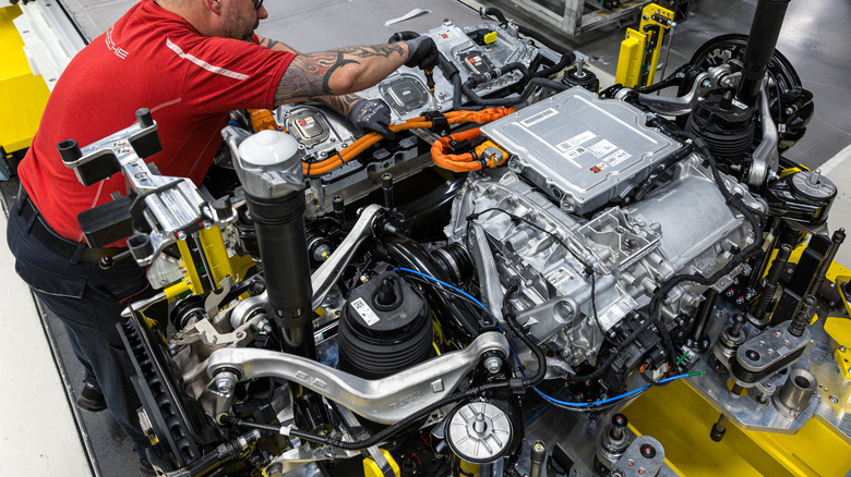 mechanic working on Porsche electric drivetrain