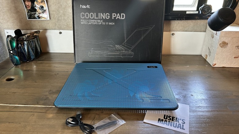 Cooling pad for a laptop on a wooden table