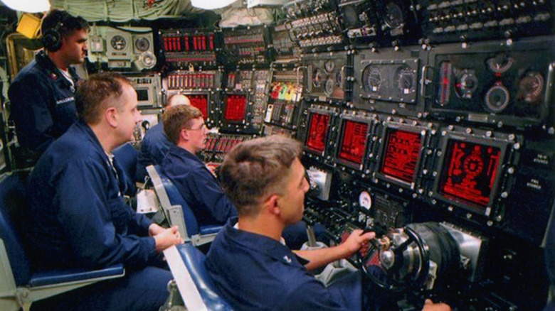 US sailors navigating a submarine