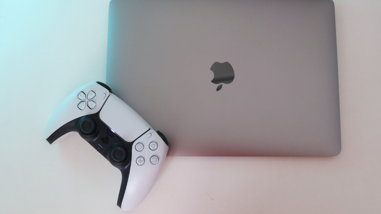 Sony PlayStation 5 controller with Apple MacBook Air