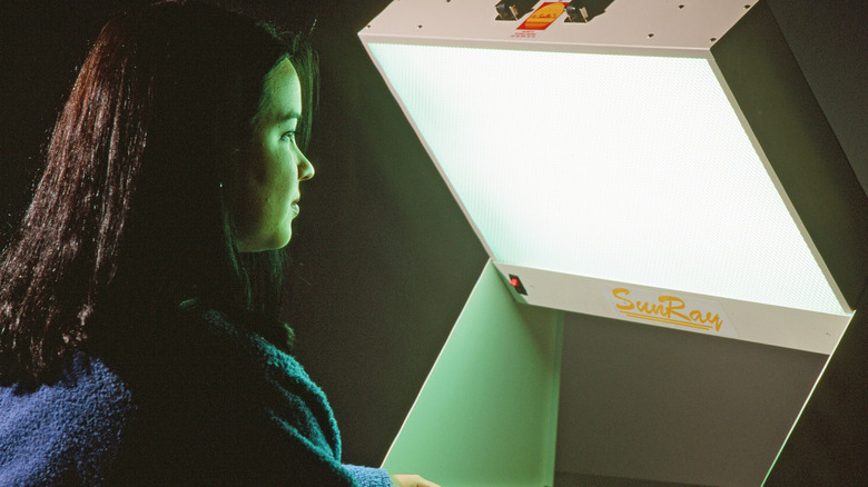 person getting light therapy