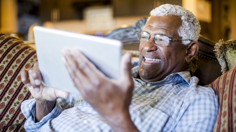 Man looking at his tablet