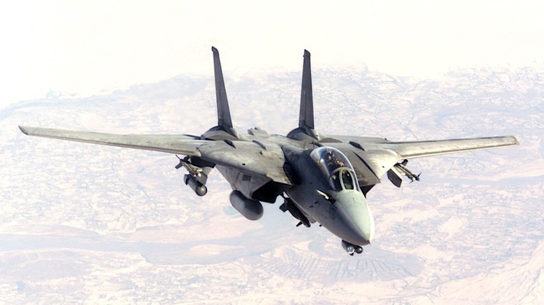 F-14 Tomcat flying with its wings expanded