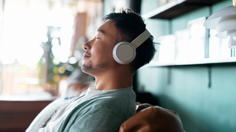 man enjoying music on headphones