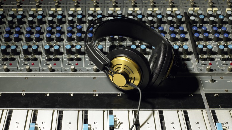 wired headphones on audio mixer