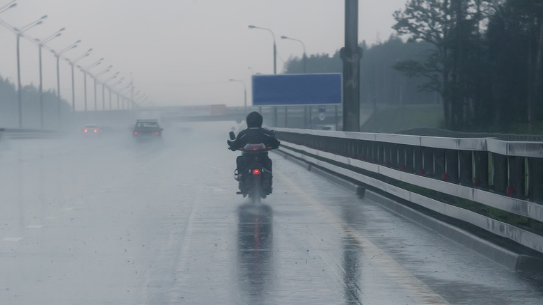 Motorcyclist rides in the rain