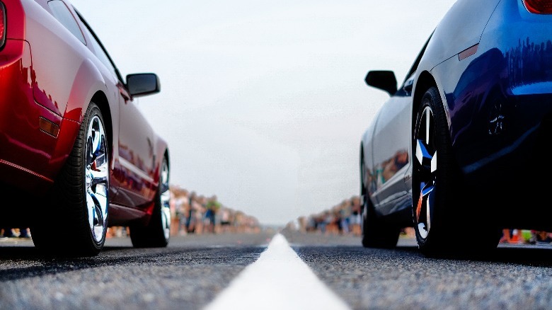 A red and blue car about to race