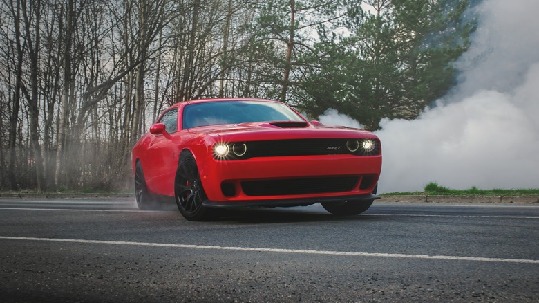 Red SRT Hellcat doing dougnuts