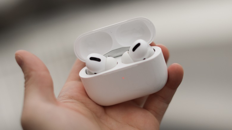 Person holding AirPods Pro