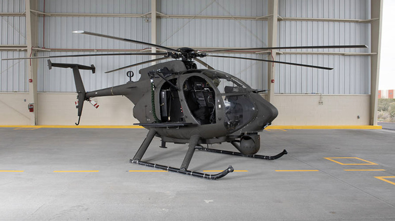 AH-6 Light Attack Helicopter parked in hangar