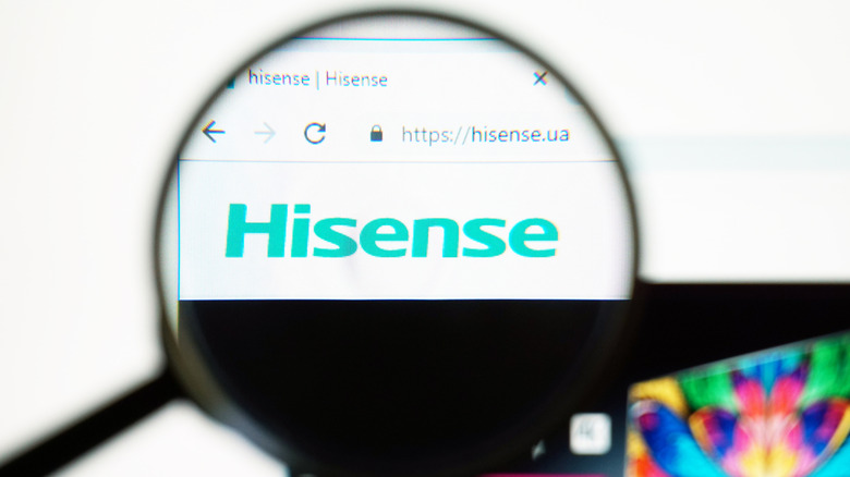 A magnifying glass highlighting Hisense in a web browser