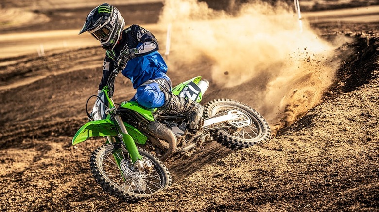 Kawasaki KX112 railing a berm