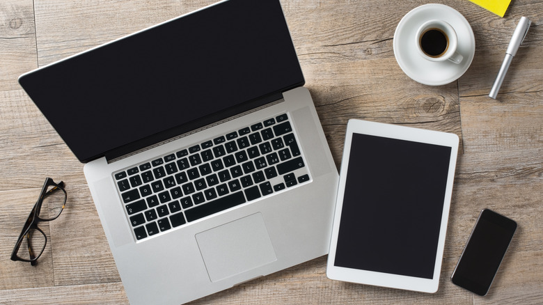 computer, tablet, phone on table