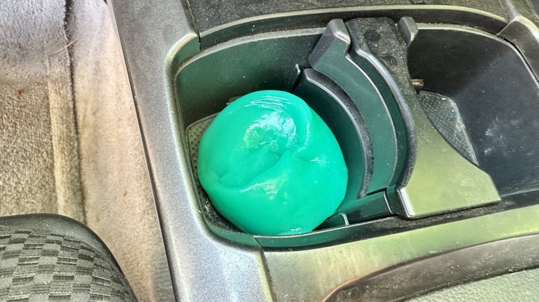 Dust cleaning gel sitting in cup holder