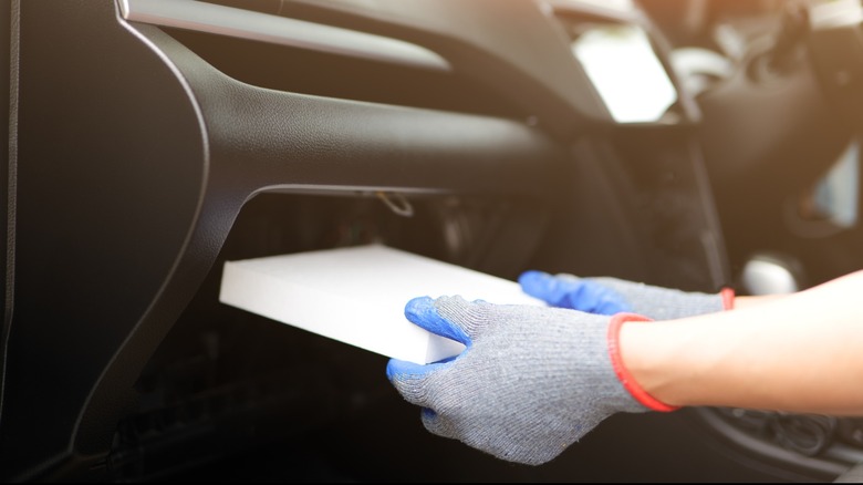 Car cabin air filter being replaced