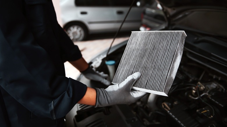 Engine air filter being replaced