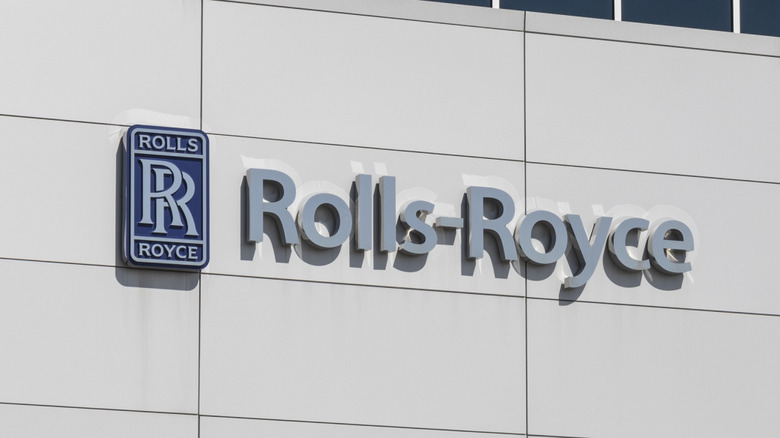 The Rolls-Royce logo on the front of a building