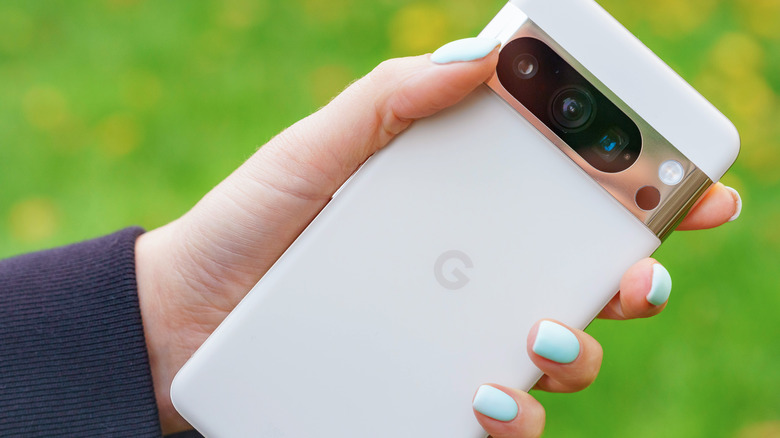 Woman holding Google Pixel phone