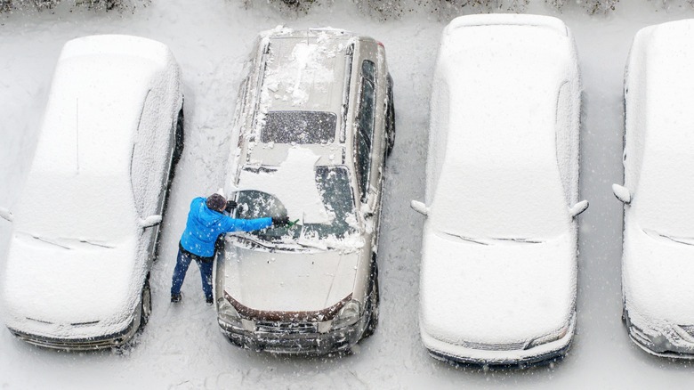 An overhead shot of cars parked outside during winter