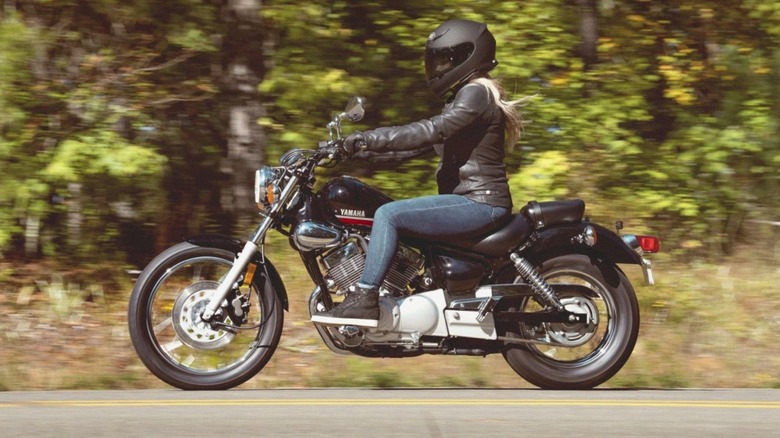 person riding Yamaha V star 250