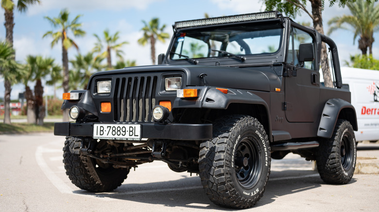 Close-up of a spectacular first generation 1987-1996 black Jeep Wrangler YJ