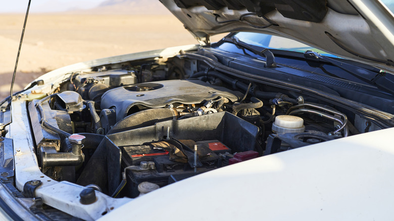 A car with its hood open.