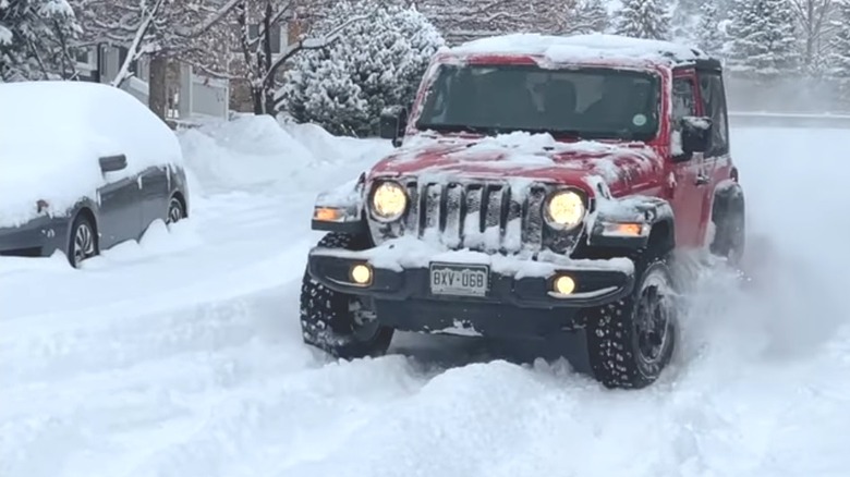 A Jeep Wrangler in deep snow