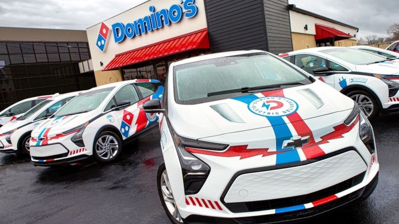 Domino's-themed Chevy Bolts parked