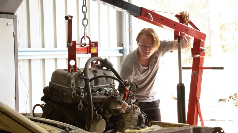 person using engine hoist