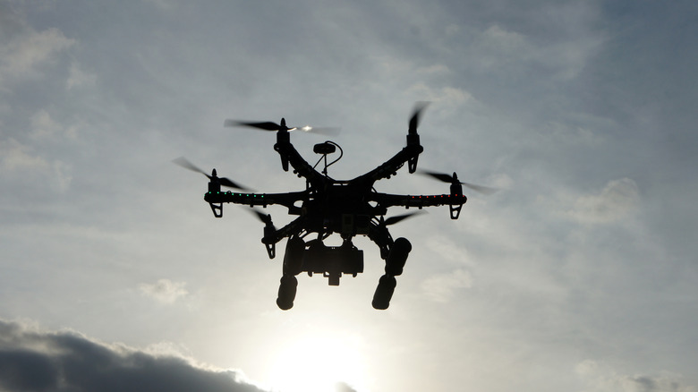 A hexacopter taking aerial photos at sunset