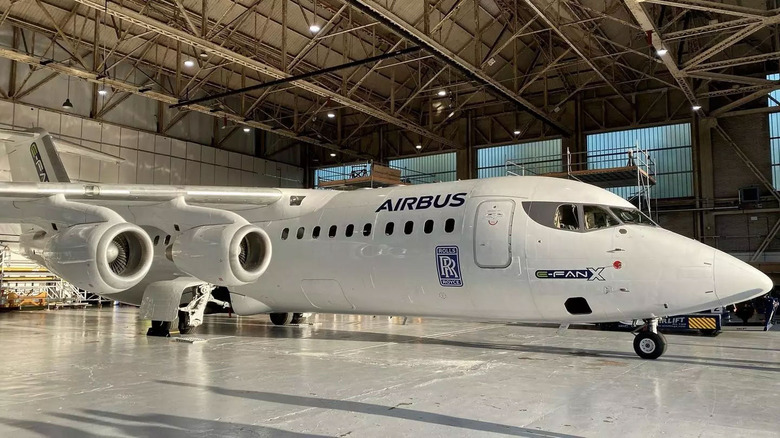 Airbus E-Fan X passenger jetliner parked in a hangar