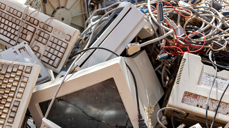 Old computers in trash pile