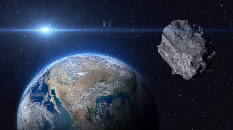 Illustration of an asteroid and Earth.