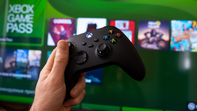 Hand holding the Xbox Series X controller