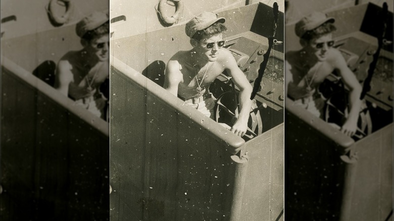 Lieutenant John F. Kennedy sitting in the cockpit of PT-109