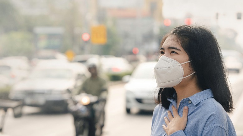 Asian woman wearing the N95 Respiratory Protection Mask