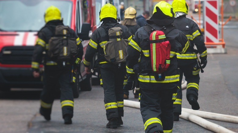 Group of fire men in protective uniform 