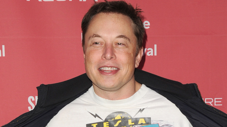 Elon Musk looking unusually happy