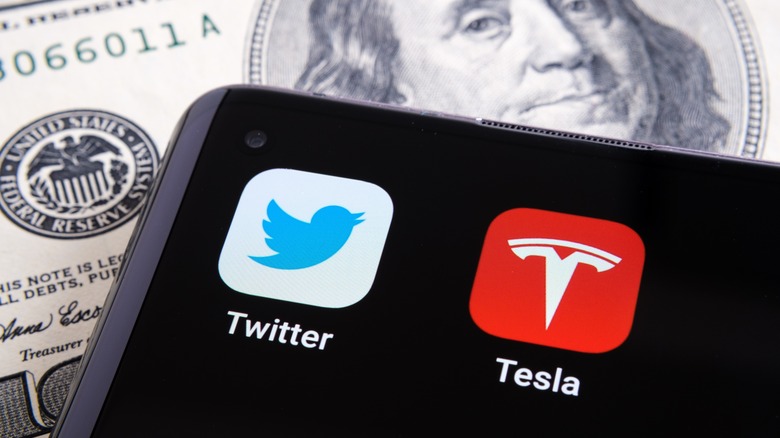 Tesla and Twitter logo on phone